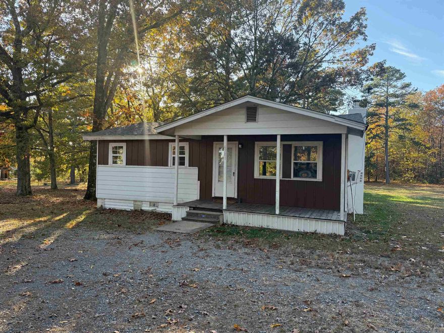 Great starter home, hard wood & vinyl floors, 3 bed rooms 1 bathlarge utility room, living room, kitchen has  almost new refrigerator, freestanding electric cook stove, insulated windows, new roof in 2024, fire place. nice storage building, garden spot, fruit trees, plenty shade trees.