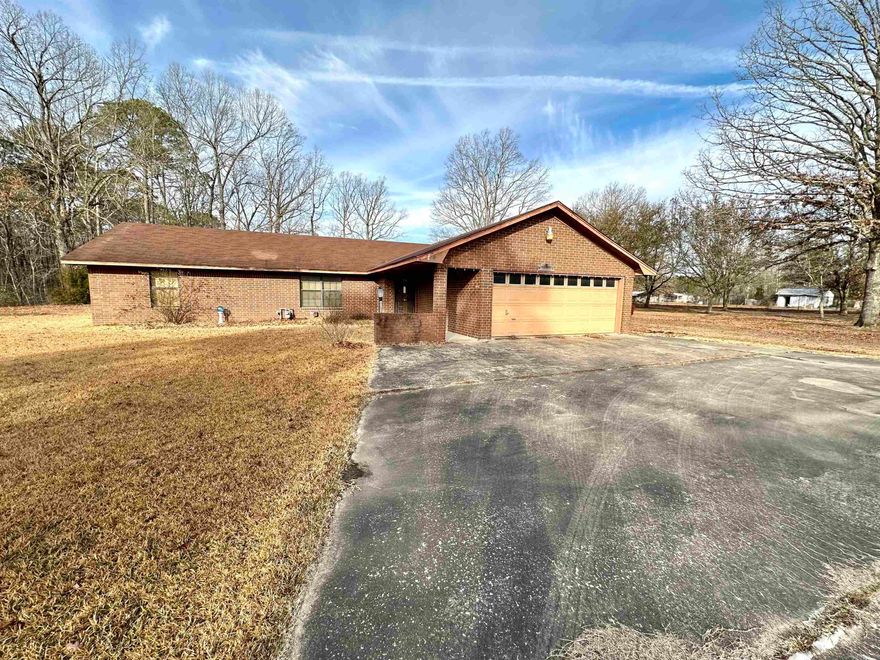 TREMENDOUS POTENTIAL! This brick home sits on 6.6 acres with a pond. 3 bedrooms and 2 baths with this 2067sf Home. 2 car attached garage. 20x20 covered patio. 30x70 Shop with a 1 bed and 1 bath apartment. This home is being sold AS-IS. See agent remarks.