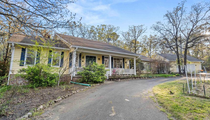 Discover a true hidden gem just 10 minutes from West Little Rock and 30 minutes from downtown Little Rock! This unique property offers the perfect blend of character, space, and privacy on a total of 7.12 acres. Featuring a main-level master and en suite, a chef’s kitchen with open shelving, hidden spacious pantry cabinets, and a custom made island, this home is designed for comfortable living. Updates abound, including new gutters and filter guards, French drains, screened in breeze way, heat pumps, stylish herringbone patio, and a Trex back deck. The property boasts a massive detached double deep, 2 car garage with insulated overheard garage door for winter projects, versatile attic space (perfect for an office or guest quarters to be finished), additional outdoor sitting area , a dedicated music/theater bonus room, new constructed 8 person storm shelter and raised garden beds. So many more details when you see in person, this includes the two lots (4-acre main lot + 3-acre adjacent lot) offering incredible privacy or space for a second dwelling. Transferable septic and crawlspace serivce policies included. A rare find—this well maintained property will not last long!