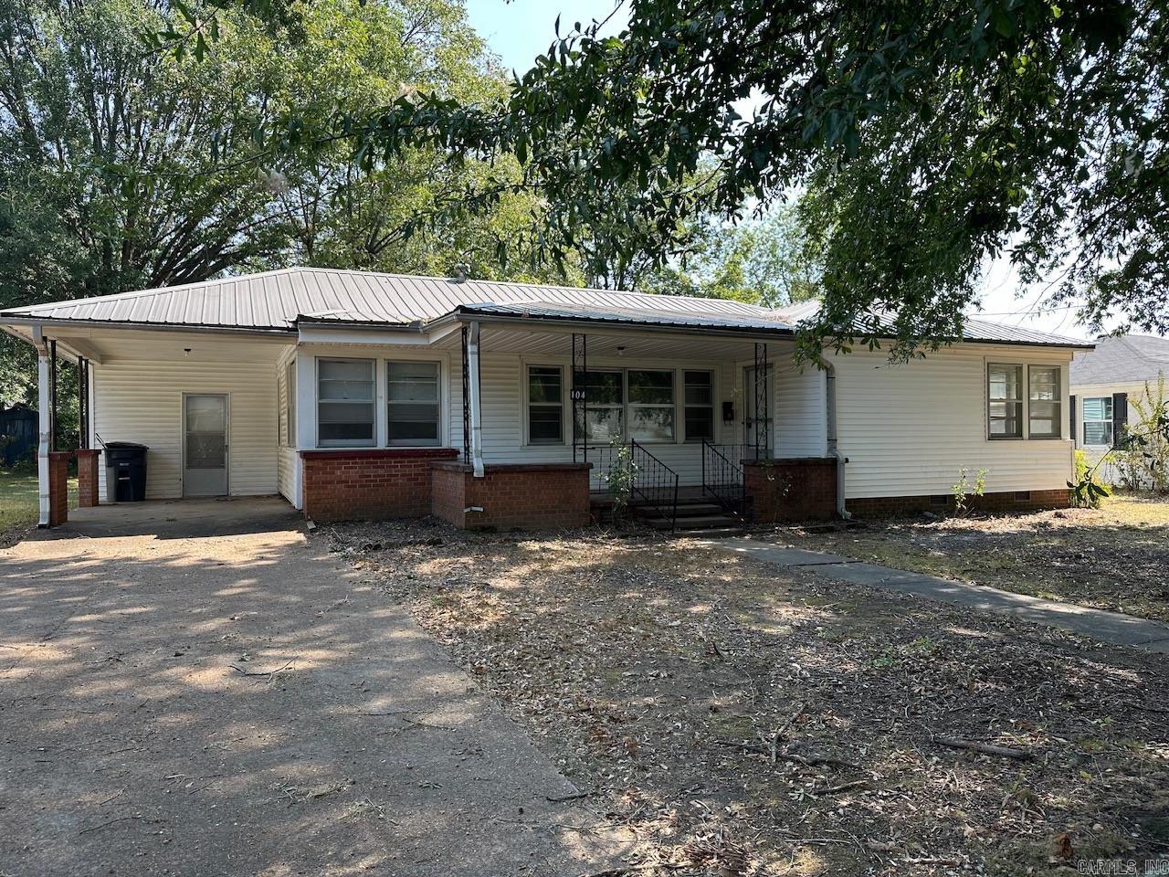 Home for Rent. Rent is $900 a month with $900 deposit, with a 12 month lease. Must fill out application and be approved before seeing the home. 104 N Olive St. in Searcy, AR is a 2 bedroom, 1 full bath home with two living room/family rooms, dining room, large covered front porch, one car carport, and laundry room. One of the living/family rooms has been used as an extra bedroom in the past, but it does not have a closet. No HUD, no pets and tenant pays for all utilities. The utilities are water, electric, natural gas. The home has central heat and air, a freezer/fridge, gas range and oven. The laundry room has hookups for washer and dryer. Listing agent has ownership interest in the property.