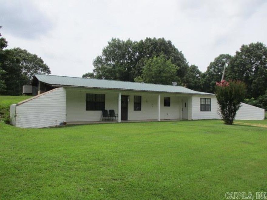 Great Location of this 10 Acre Tract for Complete Peace and Quiet, Beautiful Rolling Hills with some fenced fields and Lots of Timber, Less that 1/4 mile of gravel, This earth home affords great value for electric costs, Electric Heat and Air/with backup gas Space Heater, Carpet and Vinyl Flooring, There is also a She Shed with Electric and Finished for Storage or Extra Living Space, Also included is a 22' x 32' Poleshed, a Barn and several other outbuildings.  To be Sold "AS IS'.