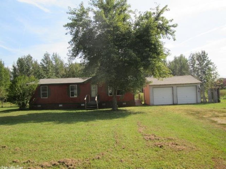 Manufactured home with three bedrooms and two baths. Large storage area. Located on acreage offering privacy for owner occupant buyers. Call today to set up a time to view and make this your new home.