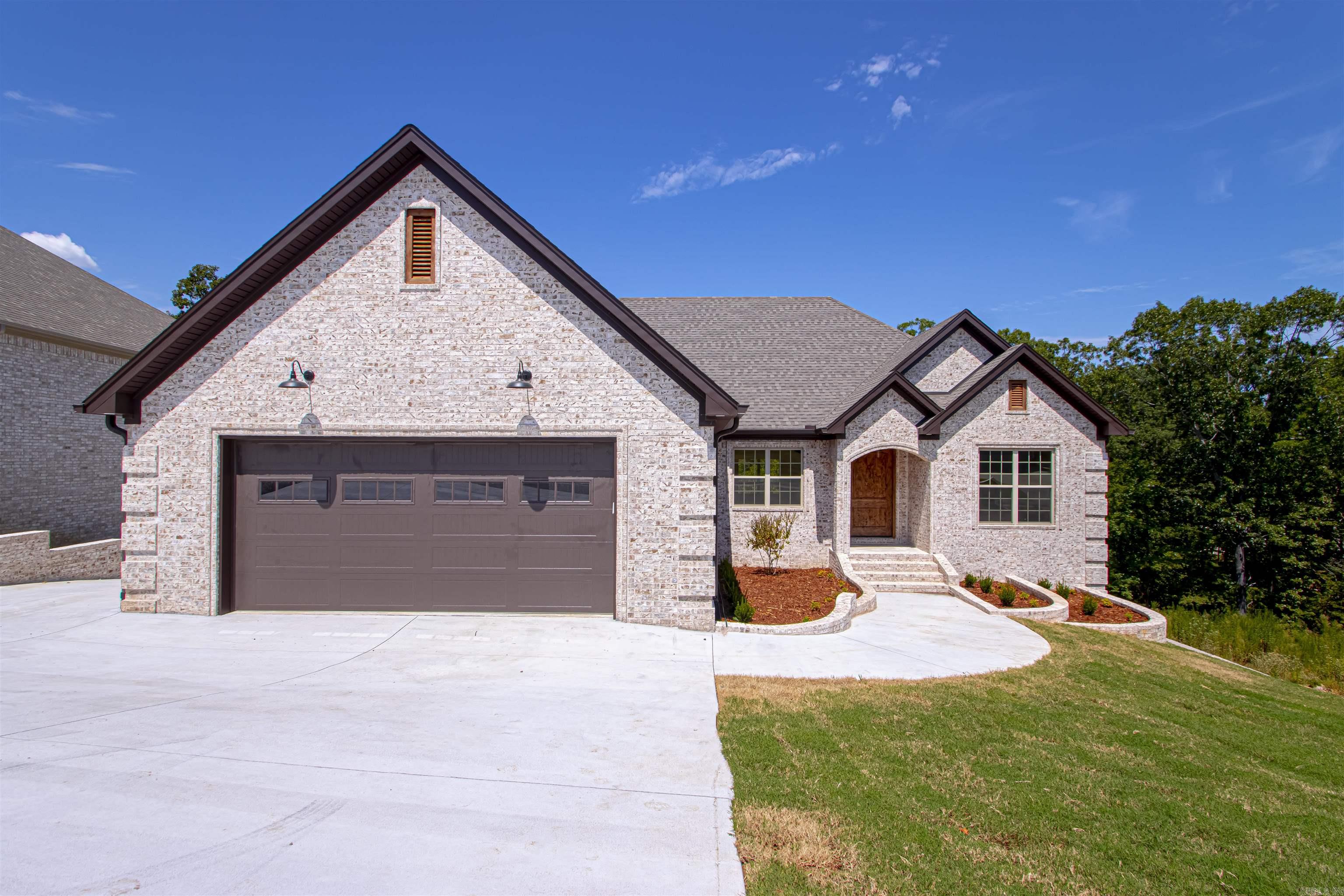 Gorgeous new construction on Stillwater in the popular Creekside subdivision with a creek & green-space behind it! You will feel like youāre on a nature retreat everyday! Natural white brick home. Four bedroom home with TWO bonus spaces! You will love the open kitchen, living, & dining areas with gorgeous high end finishes and lots of windows to enjoy the views and all the natural light. The large master bedroom with ensuite is on the main level with a big walk in closet that connects to the laundry room. There is also an office space or bonus space and two more bedrooms on the main level. The lower level has a bonus space that you can use as a play room, second living area, media room or whatever else you want! It opens up to a large patio to enjoy the yard & greenspace. There is one more bedroom & a full bathroom for kids or guests. Around back is a 1 car garage that you could use as a shop or gym or additional parking! A tankless water heater, 96% efficiency gas hvac, radiant barrier roof and gas filled vinyl windows make this home energy efficient for future savings. Go see this rare jewel today!!