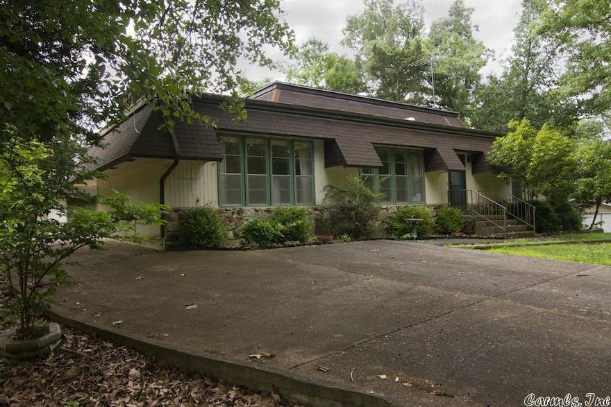 Conveniently Located! Unique 1464 sq ft 2 bedroom, 2 & 1/2 bath home with large detached garage and storage building is located on a nice level lot in Cherokee village. The home features a great open floor plan, high ceilings, a native stone fireplace and partially fenced back yard.