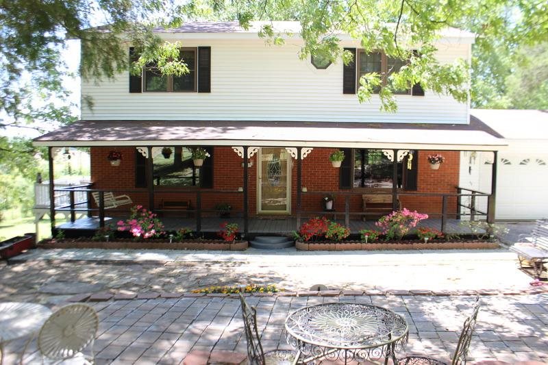 Charming three bedroom and three bathroom home nestled on a shaded one acre lot. Outside you will find extensive landscaping, a covered porch and large wraparound deck overlooking the property. Inside, a cozy family room offers a gas fireplace and wood flooring that extends throughout the home. The eat-in kitchen features abundant cabinetry and a built-in microwave. The spacious master includes a sitting area and private bath. Additional amenities include a basement, a two car garage, laundry room and barn.