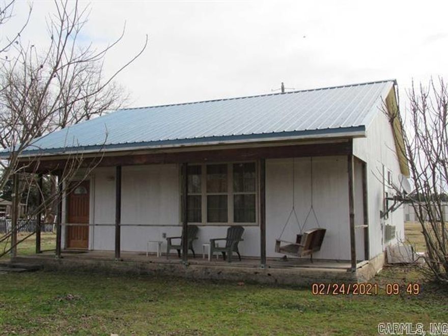 Unwind outside on your porch and enjoy the shade of the huge and very fruitful Pecan Trees. Come grab a piece of down home living to make your own or add to your portfolio. 2 yes we said 2 acres of land holding a 1bd 1 bath 900 sq ft home and a manufactured home with 2bd 2 bath further up the road at 307 Moores Ln. Both properties were previously rented month to month and have now become available for a new owner to explore their own rental possibilities or as an owner occupant. Property holds more than enough room to build and increase value. Property is being sold "As Is". Agents please check remarks.