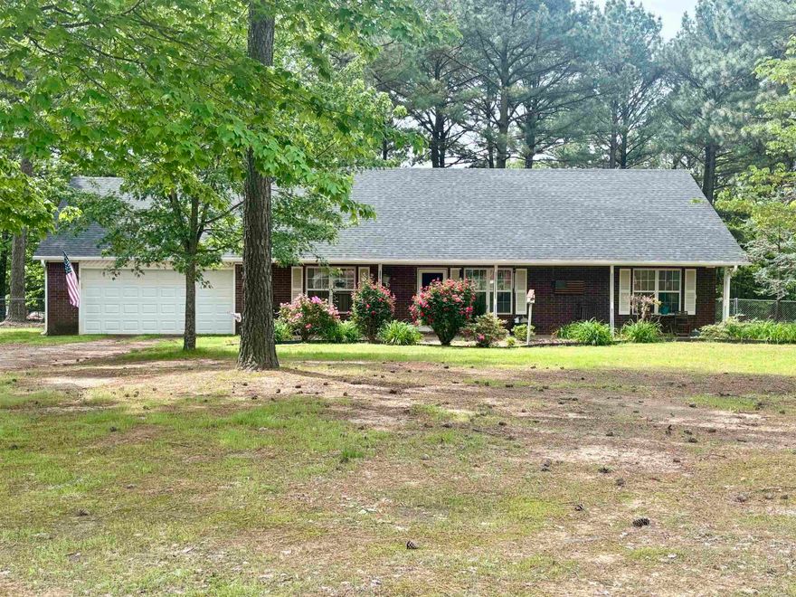 Enjoy the quiet beauty of country living in this inviting 3 bed 2 bath home set on almost 2 acres of picturesque land!! With over 1500 square feet of comfortable living space, this property offers the perfect balance of privacy, space and convenience. Then step outside to find a fenced backyard perfect for kids, pets or simply soaking up the sun!! Also, with a handy shed which provides extra storage and coverage for that lawnmower or ATV.  Call now for your showing!!