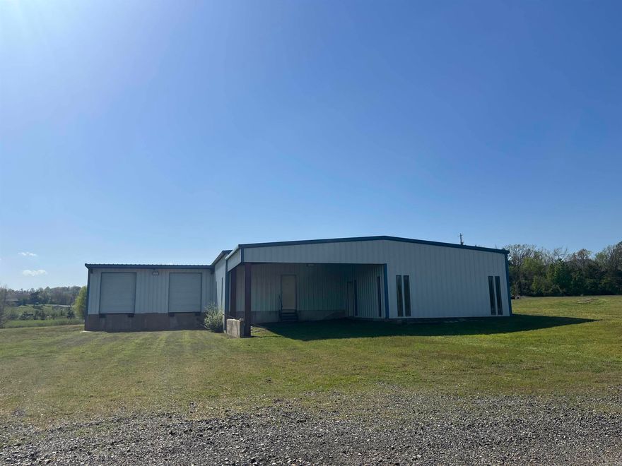 Business Opportunity!!! 3,540 sqft. warehouse w/2 acres! Recently remodeled with new electrical service and wiring! 220 and 100 power! City water with new meter installed, city sewer available! Warehouse with 3 bay doors w/access to docking and loading areas. 500 feet overhang for covered parking.  Re-enforced concrete foundation is 4 feet thick!