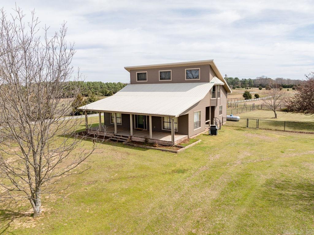 Welcome to your dream farm in Greenbrier! This unique property features a spacious home with an open floor plan offering cozy country living. The farm is equipped with an 8-stall barn, complete with a tack room and living quarters ready for your personal touch that will need updating. Inside the barn, you’ll find an arena that opens to a fenced field, perfect for training or riding. A separate hay barn provides ample storage for feed and equipment. With endless possibilities for horse lovers or farmers, this property is ready to be transformed into your ideal rural retreat!