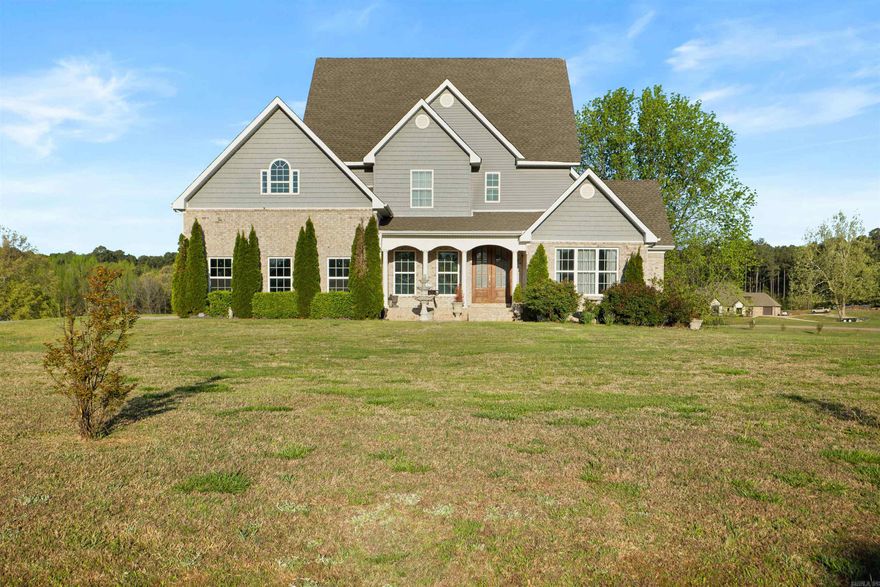 Some homes impress. Others leave you speechless—190 CR 7802 is one of them. Nestled on over 4 acres in the prestigious Bella Ridge neighborhood, this one-of-a-kind luxury property blends timeless elegance with breathtaking scenery. A formal sitting room and elegant dining room lead you to a grand, ornate staircase and a stunning two-story living room featuring floor-to-ceiling windows that overlook the custom saltwater oasis pool and a fully stocked pond. The kitchen showcases marble countertops, farmhouse sink, double ovens, and a striking wood-accent ceiling above the breakfast area. The master bath features a soaking tub, walk-in tile shower, double vanities, and extra-large closet. Upstairs you’ll find 3 spacious bedrooms, 2 baths, and a storage room. The full walk-out basement provides versatility with a large living area, game or workout room, full bath, two offices, and an oversized storage room—all of which could easily function as extra bedrooms. It even includes its own garage opening to the backyard, perfect for a workshop or extra storage. This home offers the best of both worlds—a newer, thoughtfully built residence infused with timeless antique character and charm.