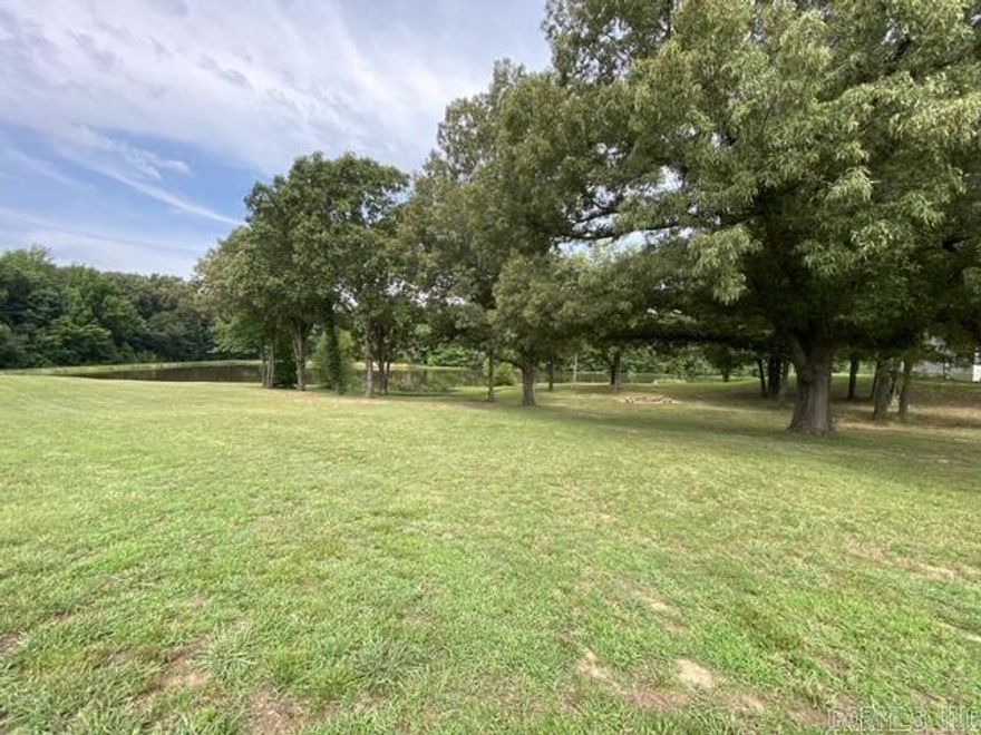 Discover the perfect blend of nature and convenience with this exceptional 5.43-acre lot located in the Bella Ridge Subdivision on Crowley's Ridge. This is the last available lot at the end of the cove, offering unparalleled privacy and tranquility. The property boasts underground utilities already in place, ensuring a seamless building experience. Enjoy leisurely afternoons fishing in your very own pond. Don't miss this rare opportunity to build your dream home in a serene and picturesque setting.