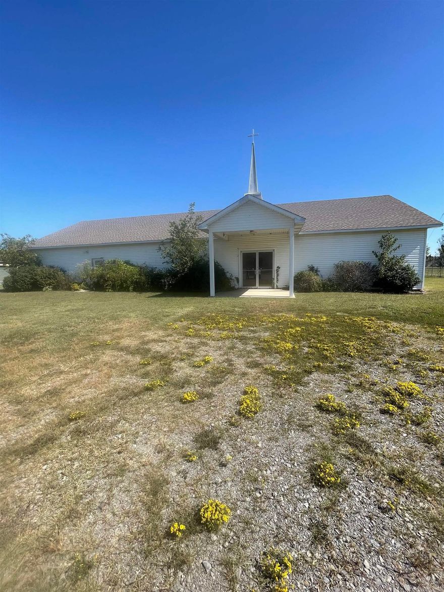 This is building and land only. It was previously Legacy of Faith Assembly of God Church. It has a large room used as a sanctuary, Kitchen/dining area, 2 half baths (toilet and sink), nursery, a couple of storage rooms. The building appears to be in good condition. This could be made into a home or business. Property is fairly level and  has a pond.