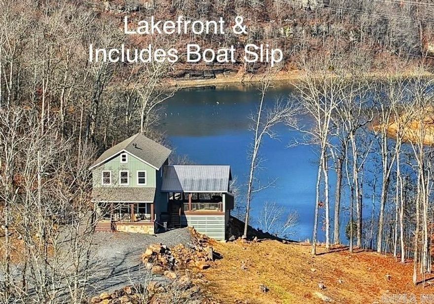 This Property checks a lot of boxes ..*BOAT SLIP *LAKEFRONT *PANORAMIC LAKE VIEWS *Newly Built Home *ACREAGE w/7 ACRES!!!! Great Location with Boat Slip in the Watersedge Community Dock (Slip #12) located in a protected cove off of Middle Fork on Greers Ferry Lake with easy access from the dock parking lot. Your guests will be Amazed as they pull up to park & immediately see the Gorgeous Views! It never gets old driving up to this home as you wind through the trees up the driveway & then the views open up as you pull up to the Lake House! Main bedroom on first floor w/ 3 other bedrooms upstairs off of the Gameroom (that also has lake views). Hand scraped 3/4" Solid hickory wood floors thoughout the home. Main level has an open kitchen/living room combo with more lake and mountain views plus walkout door onto the 24x32 covered porch w/gas fireplace (gas logs not present) where you can unwind from a day on the lake. (SEE LINKS FOR VIRTUAL TOUR AND VIDEO)
