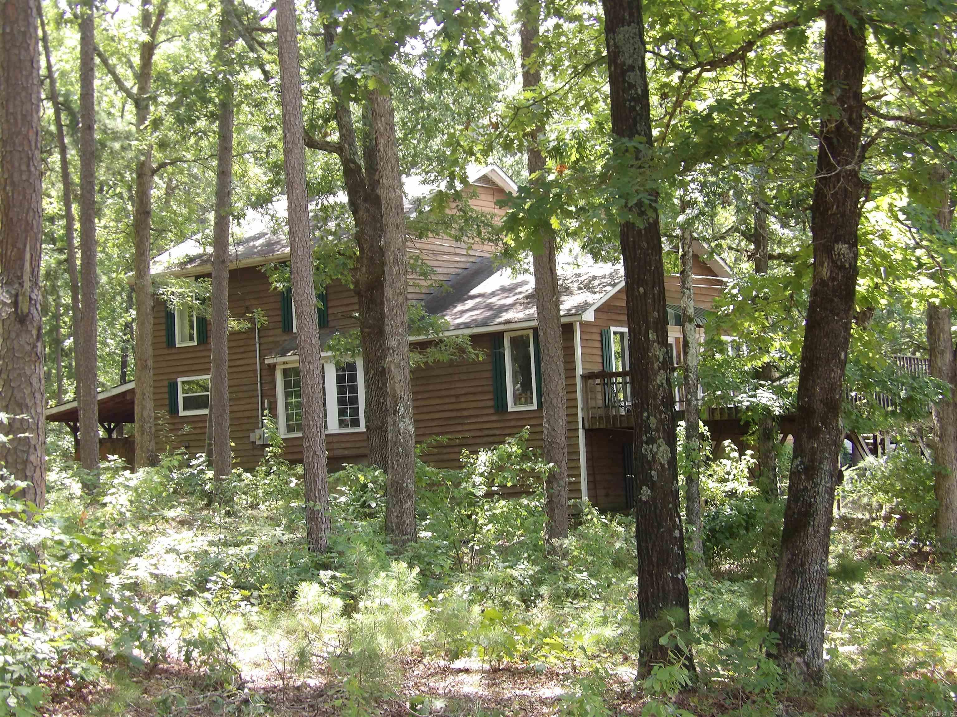 THIS SECLUDED 3 STORY HOMEIS SITUIATED ON 20 TREE-COVERED ACRES WITH WILD LIFE IN ABUNDANCE. WONDERFUL VIEW IN FALL LOOKING NORTH TOWARD MT. VIEW. THIS RUSTIC HOME FEATURES LARGE, SPACIOUS ROOMS ON EVERY LEVEL. LARGE OPEN KITCHEN, UTILITY ROOM, 2.5 BATHS, 2 LARGE MASTER BEDROOMS, ENORMOUS OPEN DEN, LIBRARY, GAME ROOM, WOOD FLOORING, CARPET AND TILE FLOORING AND SO MANY OTHER AMENTIES, SURROUNDED BY PAPER CO AND WOULD MAKE INCREDIBLE HUNTING LODGE!! LARGE 2 LEVEL DECK, AND FENCED-IN GARDEN AREA.