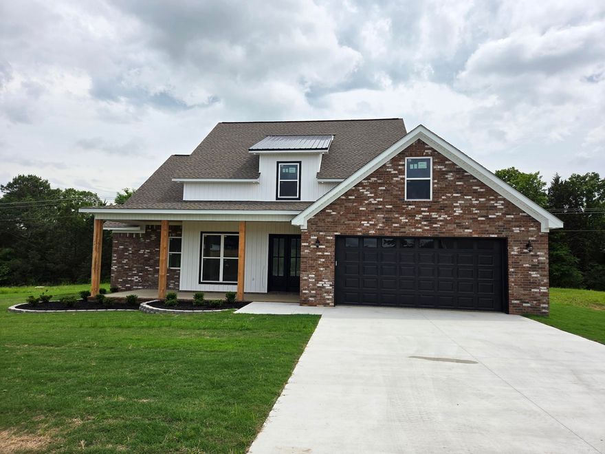 Great 4 bed, 2 & 1/2 bath brick house with two story ceilings in living room with high windows for abundant natural light & open floorplan concept. Loft above used as a 4th bedroom will look down onto the front door, living room & gas log fireplace. The kitchen has a large quartz countertops & island with pop-up receptacles & USB ports, two lazy Susan's, walk-in pantry, custom vent-a-hood & stainless appliances. Spacious primary suite has dual sinks & custom shower with a soaker tub, separate toilet room & large walk-in closet. Extra unfinished upstairs for storage that could be finished out later for a 4th bedroom or bonus room. Extra foam insulation, gas tankless water heater, separate laundry, custom cabinets & more! It backs up to wooded tree line for privacy.
