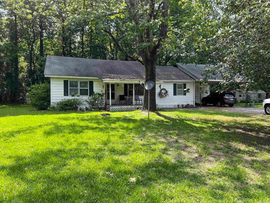 Quaint two bed two bath home on a beautiful 1.72 acre lot with detached garage and storage building. This home has a large living room, eat in kitchen and spacious bedrooms. Wheel chair ramps to do not convey with property.