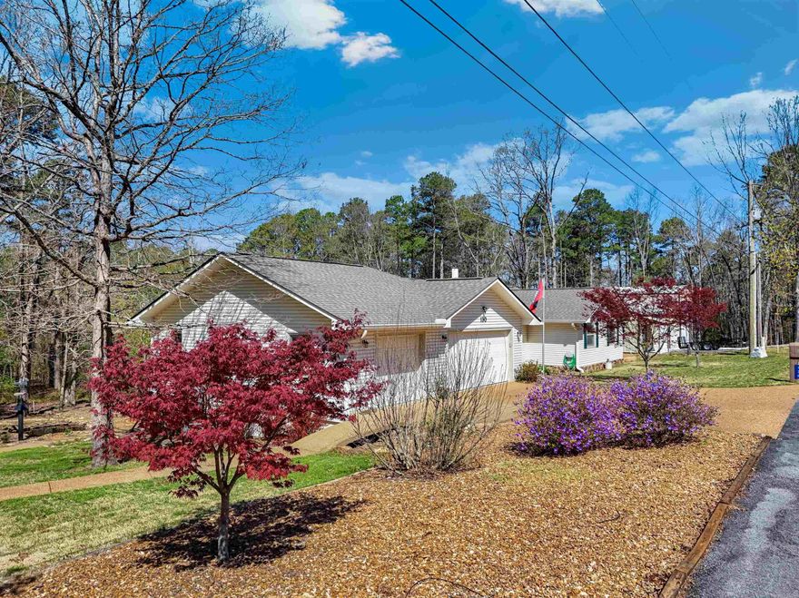 Welcome to your private retreat on 1.48 beautifully landscaped acres! This 3-bedroom, 2.5-bath home offers 2,595 sq ft with wood ceilings, a cozy woodburning fireplace, sunroom, and a well-appointed kitchen featuring granite countertops, under-cabinet lighting, and included appliances.  Major updates include a 2023 roof, new water heater, and $77,000 in Pella windows and doors. Enjoy outdoor living with composite decking, a decorative pond, firepit, gazebo, and sprinkler system.  The property also features a 2-car garage plus golf cart garage, a 2,000 sq ft heated/cooled shop, a 40’ RV bay with 50 amp/220 plug, and an additional storage building.  Located just minutes from golf courses, Fairfield Bay Marina, and area amenities—this meticulously maintained home has it all! Be sure to check out the 3D tour and drone video in the links.