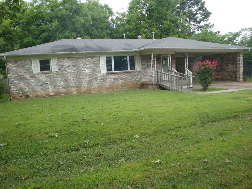Nice brick house on two lots in the center of Beebe.  It started as a traditional 3-bedroom but has been converted to a large 1 bedroom (and could easily be converted back again). Extensive decking and ramps front and back, outbuilding/shop, huge fenced yard. Updated kitchen cabinets. See Agent Remarks for details on how to bid. This is a Fannie Mae HomePath property. All bids are to be submitted online at www.HomePath.com