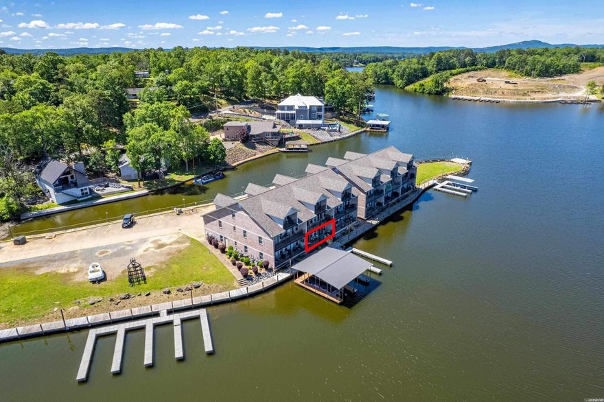 This stunning 2 bedroom/2 bath, furnished condo is located directly on beautiful Lake Hamilton. It features one car garage and is located in a quaint gated community. The stylish ground level home offers all the comforts of home you could want while enjoying life on the lake! Open kitchen and living area will make entertaining or spending family time together, a breeze. Multiple balcony access points, each with outstanding views. The primary bedroom is spacious and has luxurious ensuite. The split bedroom layout offers you and your guest privacy. Featuring its own boat slip and a private boat launch right outside of the gate. Located only minutes away from restaurants, shopping and the downtown. Situated in Lakeside School District.