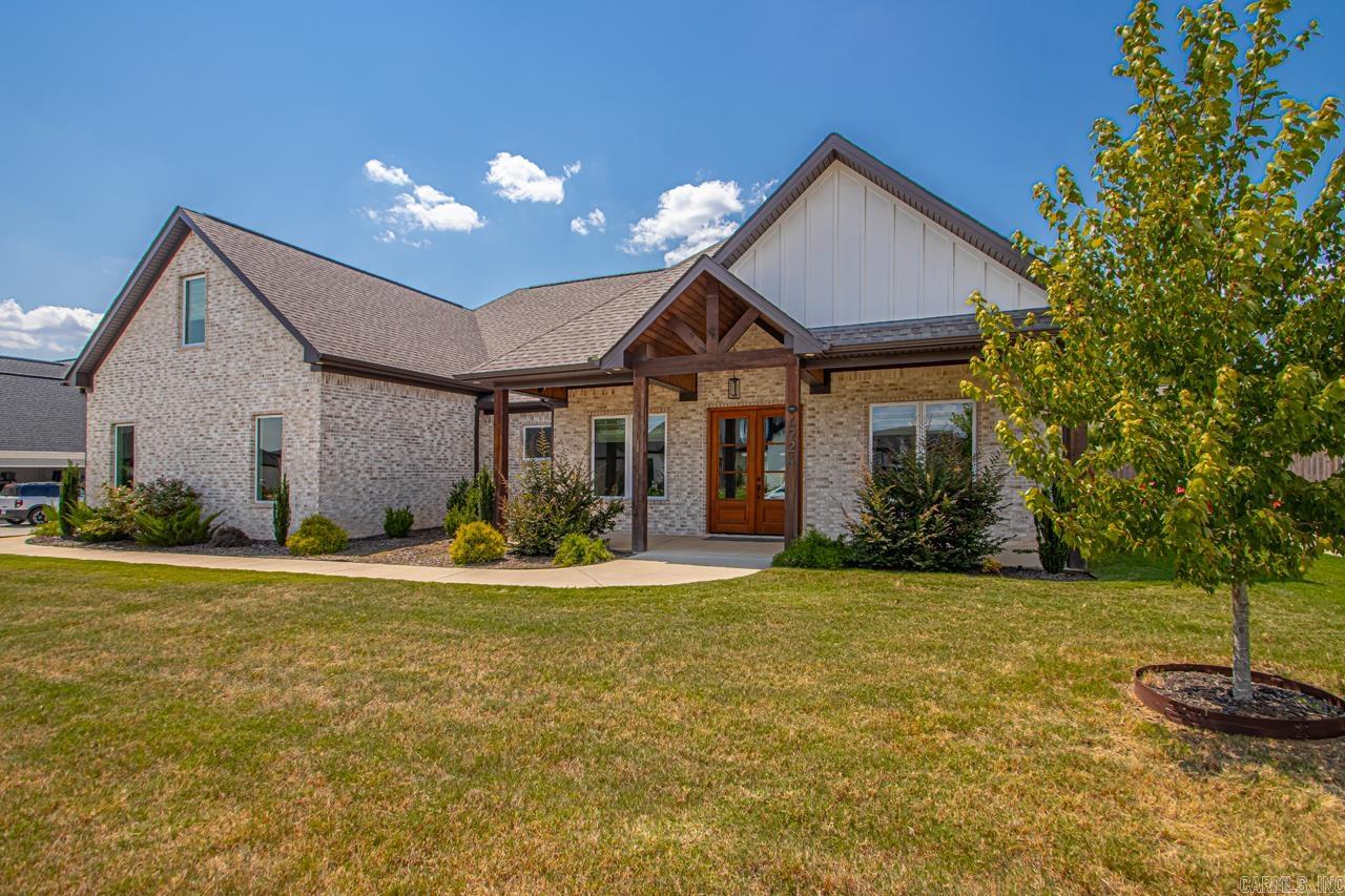 Located in the gated Hurricane Lake subdivision, this stunning 4-bedroom, 2.5-bath home offers nearly 3,000 sq. ft. of living space, a 3-car side-load garage, 10-foot ceilings, and an open/split floor plan with hardwood flooring throughout. Built in 2022, this home still feels brand new! With a spacious vaulted living room offering wood-beamed ceiling and a fireplace. Great room opens seamlessly to a show-stopping kitchen complete with quartz countertops, a large walk-in pantry, and a refrigerator that conveys with the home. The main-level primary suite offers a private escape, featuring a spa-like double shower, dual vanities, and convenient access to the laundry room. Three additional bedrooms on the main floor, upstairs a bonus room perfect for a home office, media room, or playroom. Home includes tankless water heater, sprinkler system, foam insulation, privacy fence, outdoor fireplace, mounted TV, window treatments, large covered patio. As a resident, you have exclusive access to private amenities such as a community pool, tennis and pickleball courts, and beautiful lake views!
