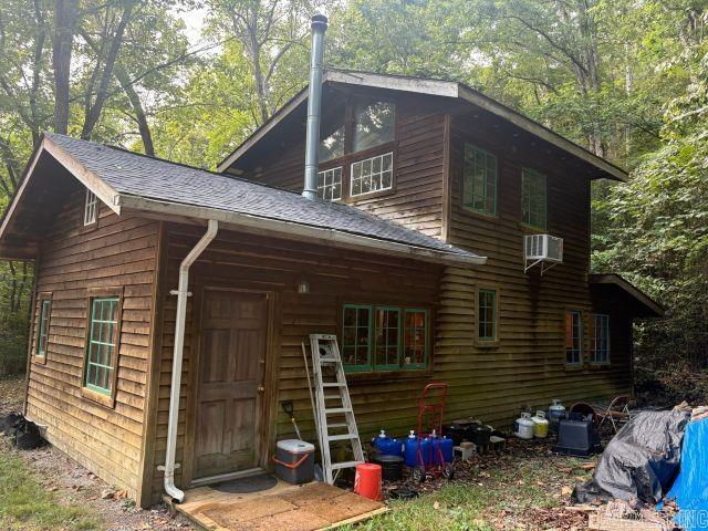 Escape to your own slice of nature with this charming 11.34-acre property featuring two homes, a year-round creek, and a natural spring. Surrounded by mature woods, this private setting offers peace, seclusion and abundant wildlife. Main home includes 1 bed/1 bath perfect for cozy living. A second 1 bed/1bath guest house provides space for family, visitors, or potential rental income. Whether you're looking for a full-time residence, vacation retreat, or income property, this peaceful woodland sanctuary is ready to welcome you.