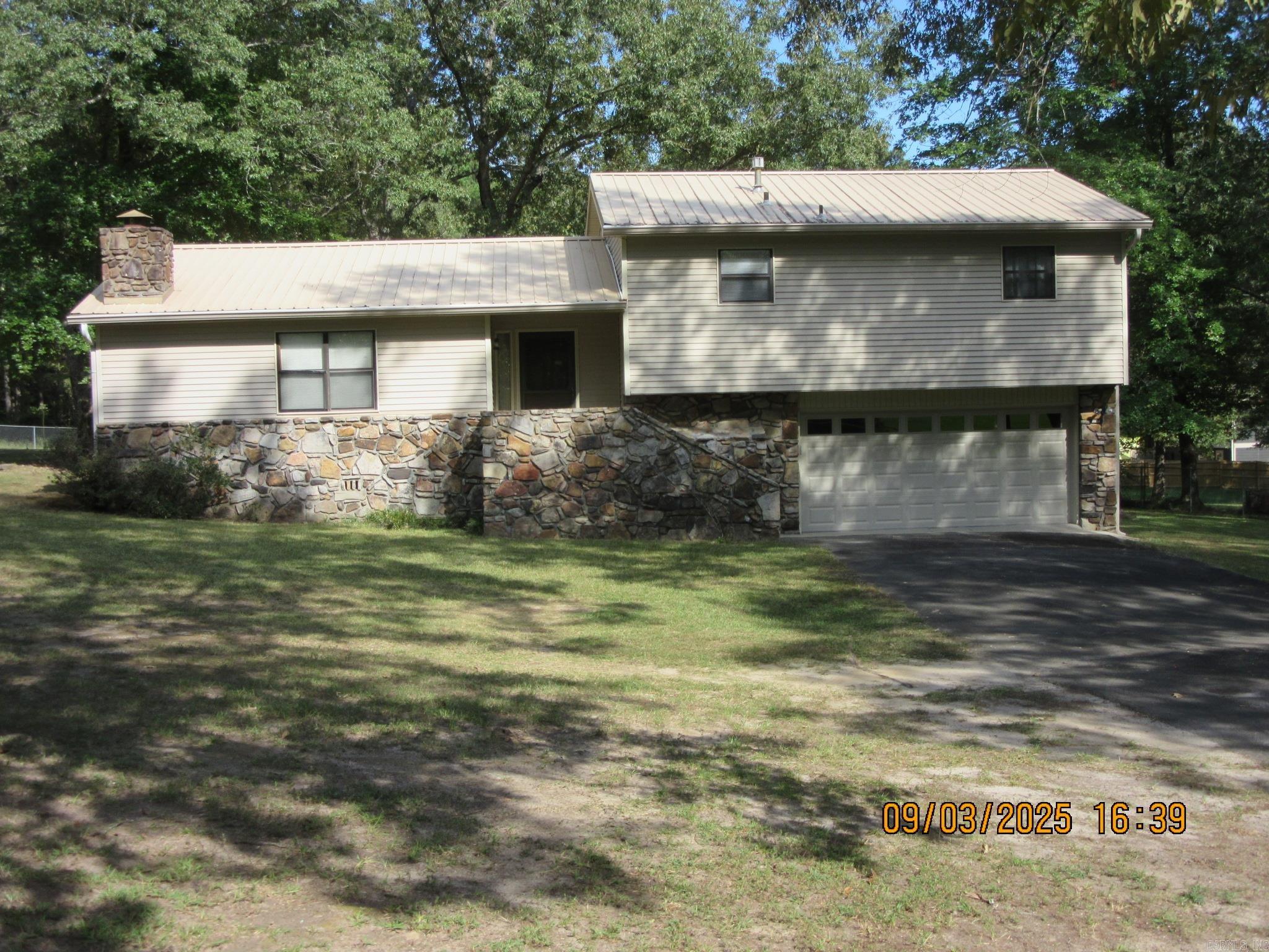 Solid 3 bed 2 bath Tri-level on approx 1.5 acre fenced lot! 600 sq ft shop with elec! Metal roof on house and shop! Located at end of quiet street and only minutes to downtown. SEE AGENT REMARKS