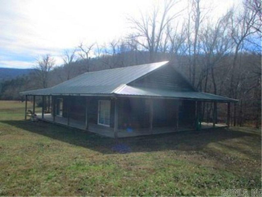 6.6 acres with cabin and shop on the headwaters of the Cossatot river.