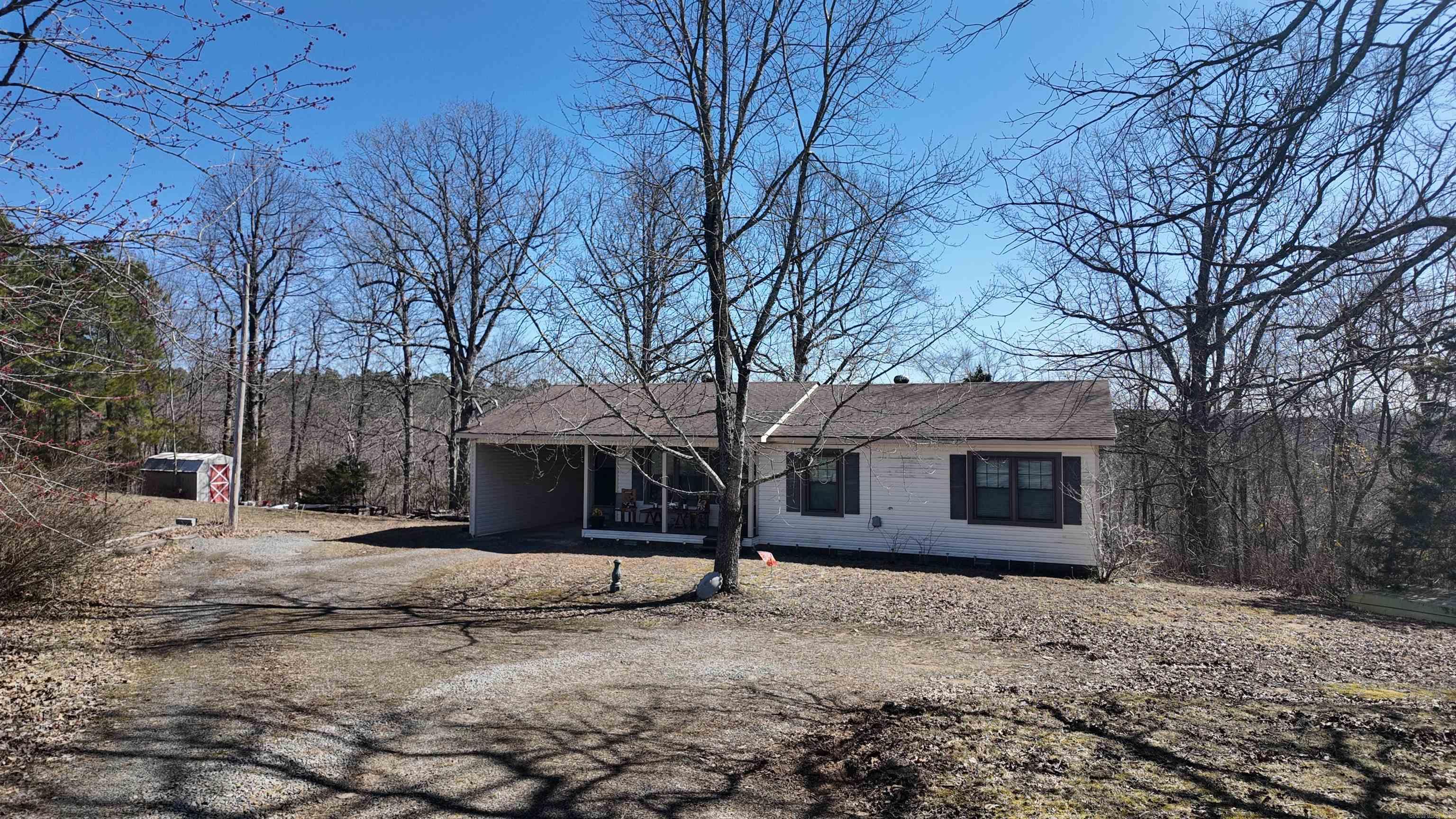 Take a look at your new home. This very well maintined home is 3 bedroom and 2 full bath. With forty (40) acres to roam there are endless opportunities for hiking, hunting, or just reconnecting with nature. Nestled just off the highway you will find a home that is a great starter or even better retirement home. The home features a HVAC unit less than a year old and the roof is approximately 6-12 years old. With just a little touch from the new owners it would become the perfect home. The back deck had gorgeous views of the property. Home is being sold AS IS.