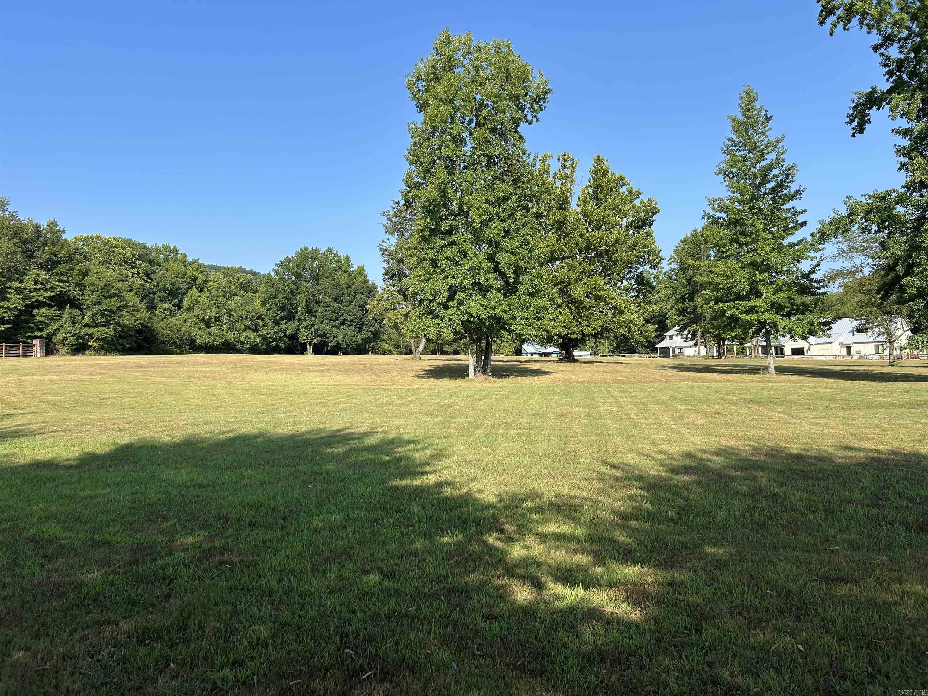**Premier Lot in Rivers Edge Subdivision** Discover the finest vacant lot in Cleburne County, a rare gem in the prestigious Rivers Edge Subdivision. Close proximity to the Little Red River, this exquisite lot offers unrivaled luxury and natural beauty, perfect for your dream home. Backing up to a lush green area, it ensures privacy and stunning views of Libby Bluff with the soothing sounds of the river just steps away. The subdivision is adjacent to a public launch ramp at Lobo, enjoy world-class fishing and boating on the pristine Little Red River. Rivers Edge redefines upscale living with gated entry for security and exclusivity. Savor premium amenities: a community boat dock for waterfront adventures, a sparkling pool for relaxation, a charming pond, & a clubhouse for gatherings. Utilities—water, high-speed internet, and electric—are conveniently at the road, ready for your custom build. This lot is more than land; it’s a lifestyle of elegance and adventure. With its prime location, unmatched amenities, and serene riverside setting, it stands alone as Cleburne County’s most coveted property. Seize this opportunity to create your legacy in a paradise of luxury & tranquility.