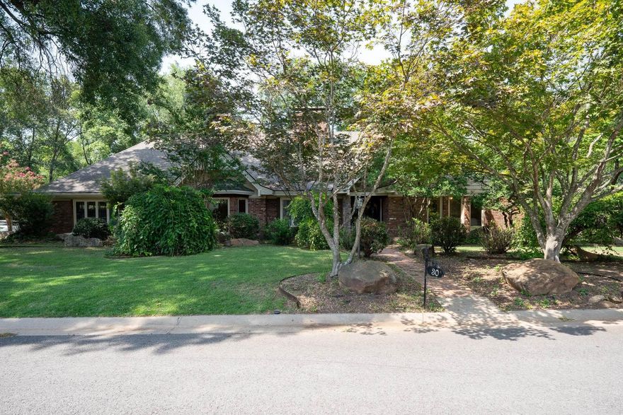 Come see this 5 bedroom, 4.5 bathroom home in Jefferson Place subdivision. This home sits on a beautifully landscaped corner lot with a split floor plan. 4 bedrooms, 3.5 bathrooms downstairs with a formal dining room, formal living room, Family room with huge brick fireplace, walk-in pantry, wonderful master suite with a fireplace, walk-in shower, two sinks & two closets. This home offers a bonus room with wet bar, sunroom off the living room with nice French doors! Make your way upstairs where there is an office with built ins as well as a bonus room with a full bath and walk-in attic! Carpet in all bedrooms is new as well as some of the flooring and a new roof. The backyard has a wonderful deck area for entertaining! Come see this home today! AGENTS SEE REMARKS