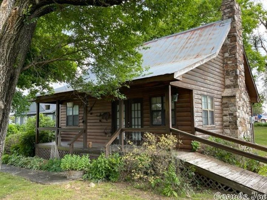Two Homes...Side by side in Ash Flat, Arkansas. Combined square footage of 1,860 per tax records, most recently used residentially with commercial potential.  Having a total of 4 beds (when long-time owner used the loft) and a full bath in each home, plus enough area to expand on .73 acres +-, there are many options to fully utilize and fit your needs. Owner says to sell "As Is". She is not aware of any major issues, using the primary residence as she wishes, but is not interested in making upgrades or repairs. Cabin built 1992, Home built 1946+- with remodel during 1988.