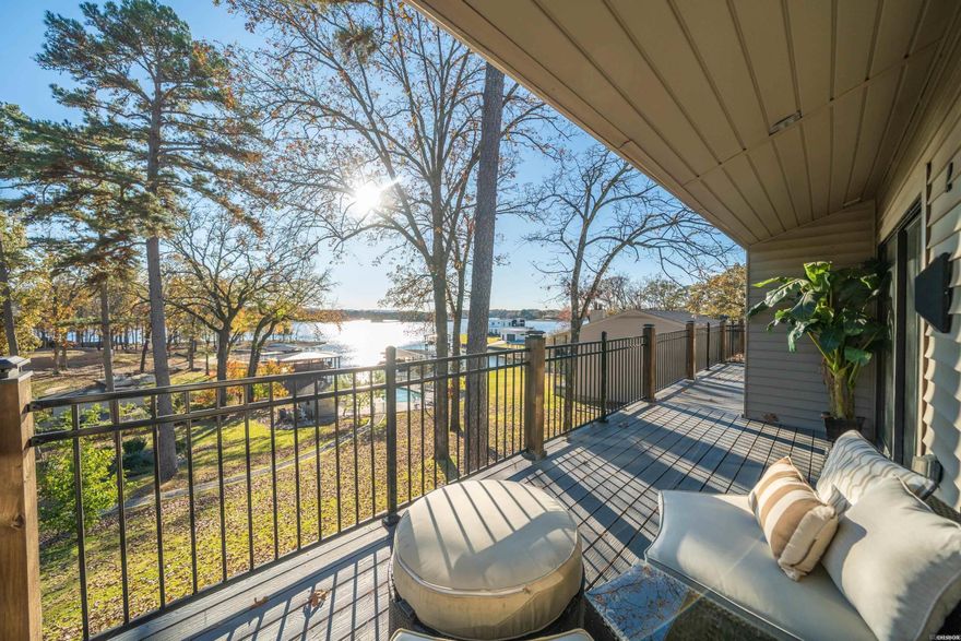 This well-appointed 3-bedroom, 2-bath Lake Hamilton condo offers a refined lakeside lifestyle with effortless convenience. The expansive balcony captures peaceful water views and extends the main living area for year-round enjoyment. A dedicated dining room provides space for entertaining, while the primary suite offers comfort with its oversized walk-in shower, double vanities, and substantial closet space. Owners benefit from community amenities including a swimming pool, boardwalk and common areas. New decks and roofs were recently installed throughout the complex. This is an ideal condo for a buyer seeking a quality lakefront residence or second home with convenient access to everything Hot Springs has to offer.
