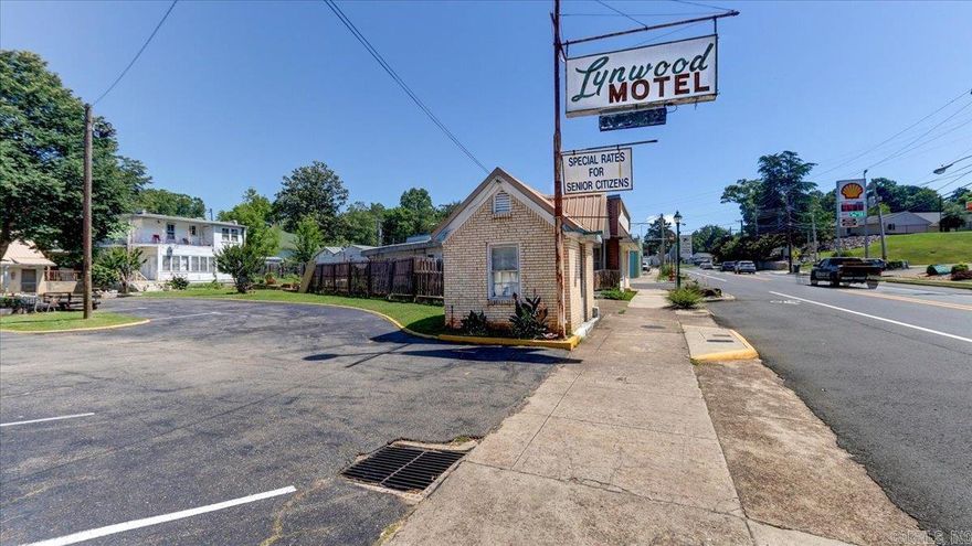 Opportunity Knocks!  16 Unit Court with Office and Residence on one property. Built in 1942 (In 1942 the Army-Navy hospital, where the thermal baths of Hot Springs were used to rejuvenate the soldiers waiting to return to duty). On the Historic Registry as a classic 1940's court. See attachment.  Each unit average 492 sq. ft. open room with kitchenette and bathroom. Window HVAC.  Put your own style and love into this vintage motel.  Family Residence with 1471 Sq. Ft.(Built 1890) and 160 sq. ft. Office.