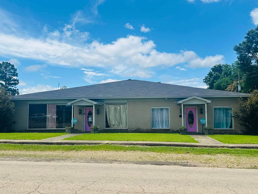 This versatile commercial property offers over 5,500 square feet of opportunity in a high-visibility location just off the main street. Previously home to a salon, boutique, and tanning studio, it’s already set up to accommodate a variety of business types. Inside, you'll find several individual rooms perfect for private offices or treatment spaces, plus two large open areas ideal for retail or collaborative workspaces.  Function meets flexibility with two front entrances and two side entrances—great for creating separate access points for multiple uses or tenants. A sizable storage room provides valuable space for inventory or equipment, helping keep the main areas clutter-free. The roof was replaced in 2021, giving peace of mind as you plan your next venture.  Whether you’re looking to expand an existing business, start something new, or invest in a multi-use commercial space, this property offers the square footage and layout to make it happen.