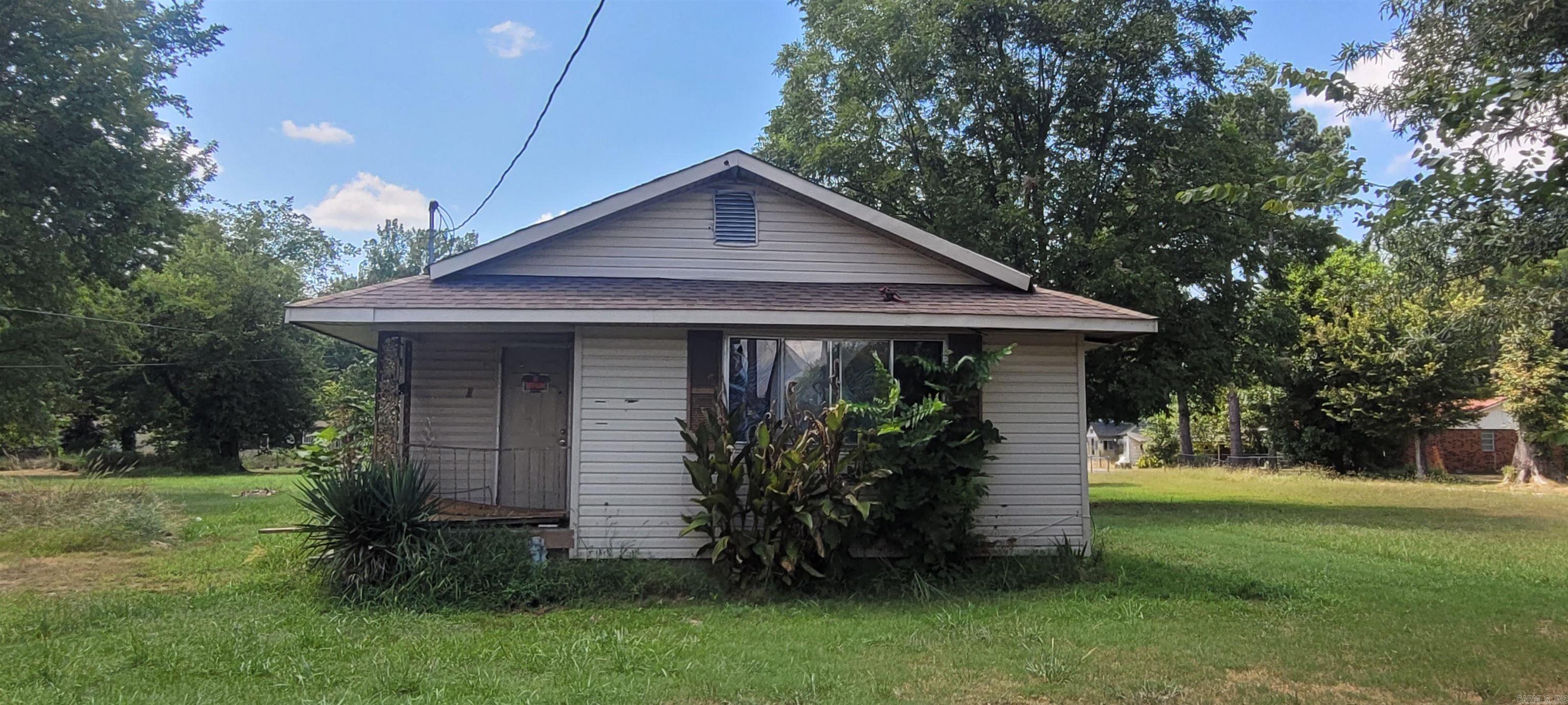 Fixer upper with potential for investment property or family home after renovations. Adjacent lot is being included and provides ample space for parking. Roof was recently replaced. No central heat and air. No utilities on. *Agents see remarks.
