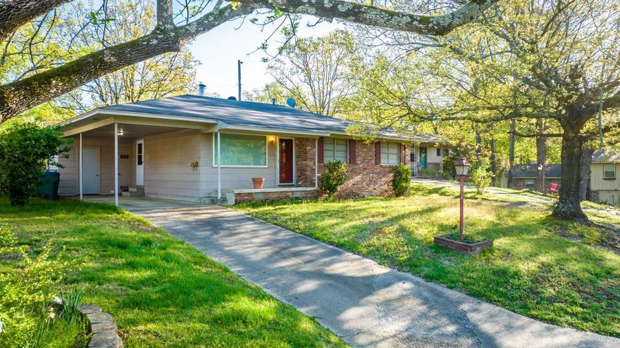 Single-level brick home offering comfortable living with a functional layout, generous room sizes, and excellent outdoor space. Situated on a spacious lot, this property blends classic character with everyday practicality.  The interior features a bright living area with large windows that provide abundant natural light. The kitchen offers ample cabinet and counter space along with a breakfast bar that opens to the dining area, making it ideal for casual dining or entertaining. Sliding glass doors lead to a private patio, extending the living space outdoors.  The home includes multiple bedrooms with hardwood flooring, ceiling fans, and ample closet space. Bathrooms feature vintage tile finishes with plenty of natural light.  Additional features include single-level living, brick exterior, hardwood floors in bedrooms, separate dining area, large yard with mature trees, and off-street parking.  Conveniently located in an established Little Rock neighborhood with easy access to shopping, dining, and major roadways. Schedule your showing today.
