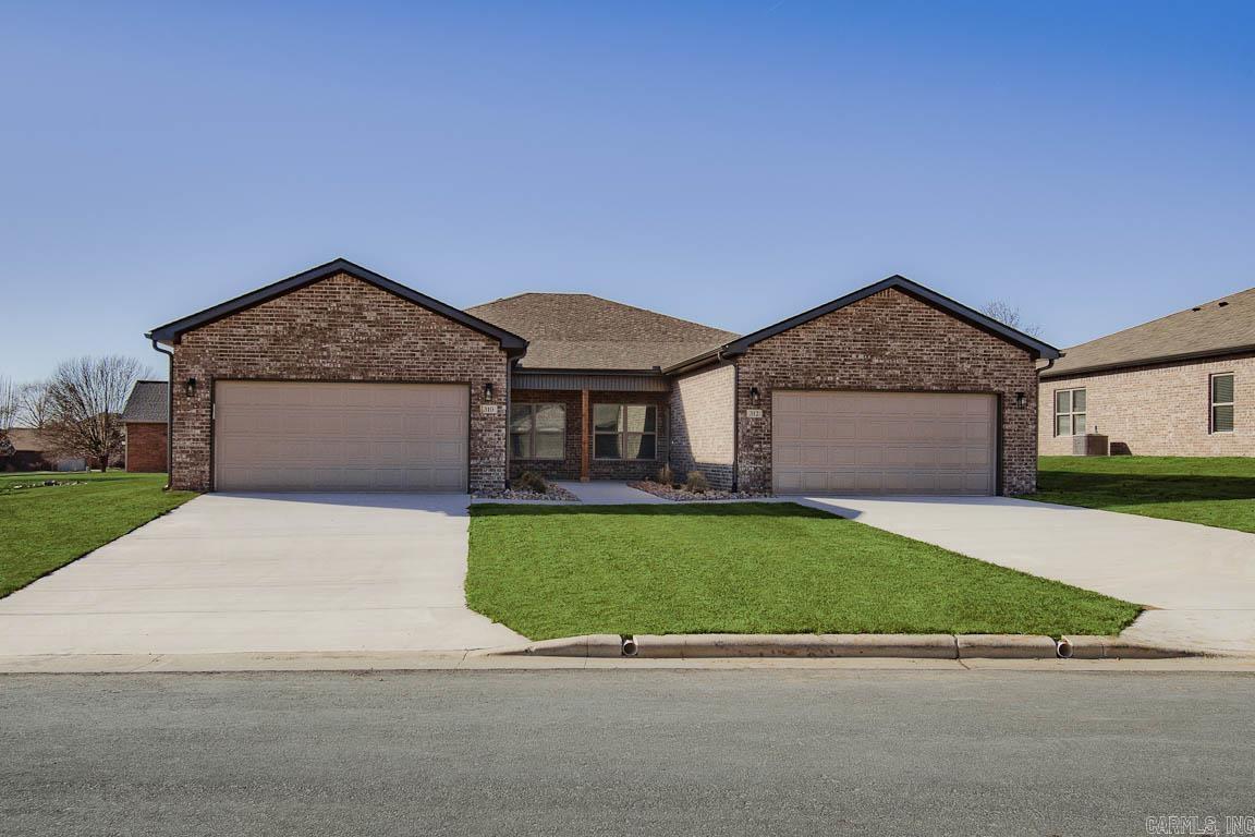 Now available in the prestigious Big Creek Country Club—new construction patio home offering low-maintenance, energy-efficient living. This thoughtfully designed all-brick home features 3 bedrooms, 2 bathrooms, and an attached 2-car garage. Inside, you'll find an open-concept layout with abundant natural light, luxury vinyl plank flooring throughout, and contemporary finishes. The kitchen includes white shaker cabinets, solid surface countertops, and stainless steel appliances—dishwasher, range, microwave, and full-size refrigerator—all included. Home also features 3-foot-wide doorways, lever-style hardware, walk-in closets, 2" blinds, full gutter systems, covered rear patios, and a washer and dryer. Located just minutes from golf, dining, and local amenities, this home offers a perfect blend of style, comfort, and convenience.