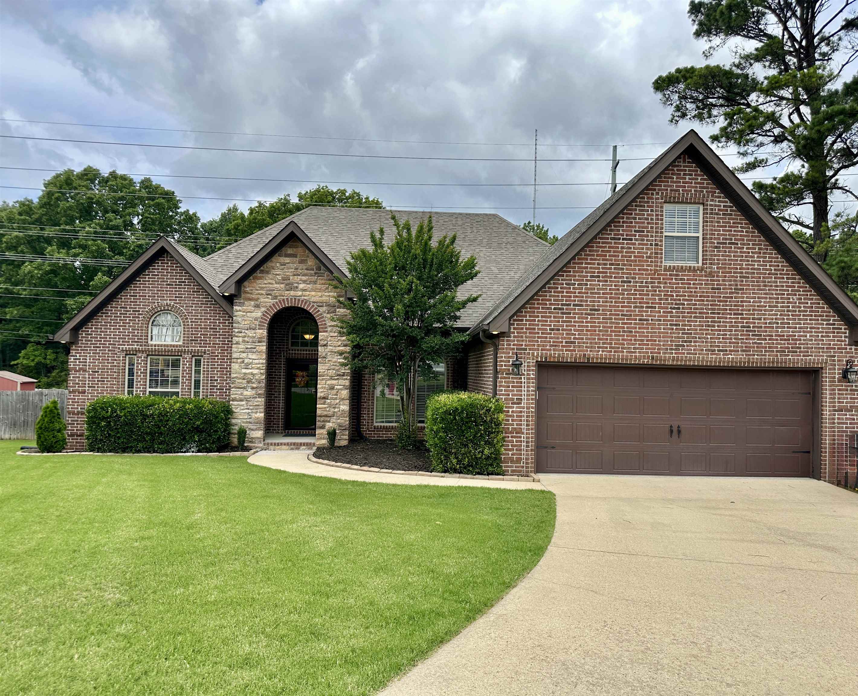 Stunning Brick & Stone Home in Sought-After Valley View School district with 5 Bedrooms and 3 Full Baths. Welcome to this fantastic brick and stone residence nestled in the desirable Valley View area. This elegant home features a formal dining room highlighted by stately brick columns and beautiful hardwood floors. The spacious family room boasts a cozy fireplace and soaring ceilings, perfect for relaxing or entertaining. The eat-in kitchen is a chefās dream, complete with granite countertops, a breakfast bar, and a built-in oven. The luxurious primary suite offers a peaceful retreat with a private sitting area and an en-suite bathroom featuring a soaking tub, separate shower, and a large walk-in closet. Three additional bedrooms and a full bathroom are conveniently located on the main level. Upstairs, you'll find a large bonus room or 5th bedroom with its own closet and full bathāideal for a guest suite, media room, or home office. Additional amenities include a two-car garage, a privacy-fenced backyard with classic brick posts, and a covered patio that opens to a deckāperfect for outdoor entertaining.