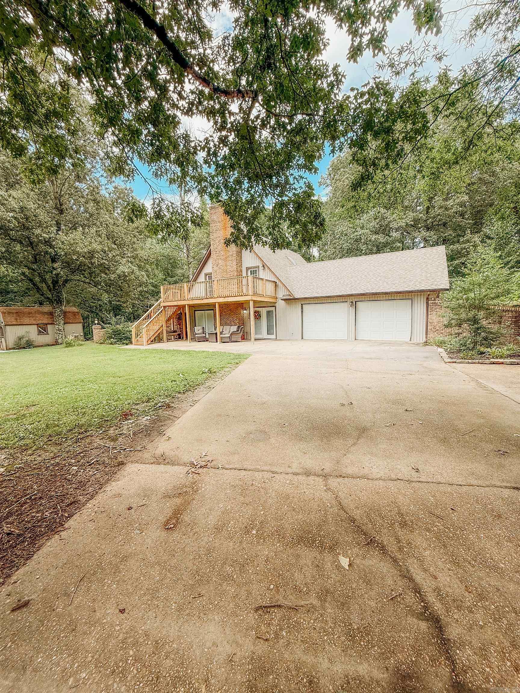 Enjoy the serenity of the countryside while staying connected with this beautifully maintained 3-bedroom, 2 bath home nestled on approximately 2 acres off a paved blacktop road. This charming home features brand new wood flooring installed by Burns Flooring in 2024, a cozy layout, and all kitchen appliances stay for your convenience. Step outside to your newly built deck, perfect for relaxing as you take in the view of the private pond and surrounding trees. The fenced backyard provides a safe space for pets or children, and you'll appreciate the two storage buildings for all your tools and toys. Whether you're looking to escape the hustle or enjoy space to roam, this property offers the best of country living with modern comfort.