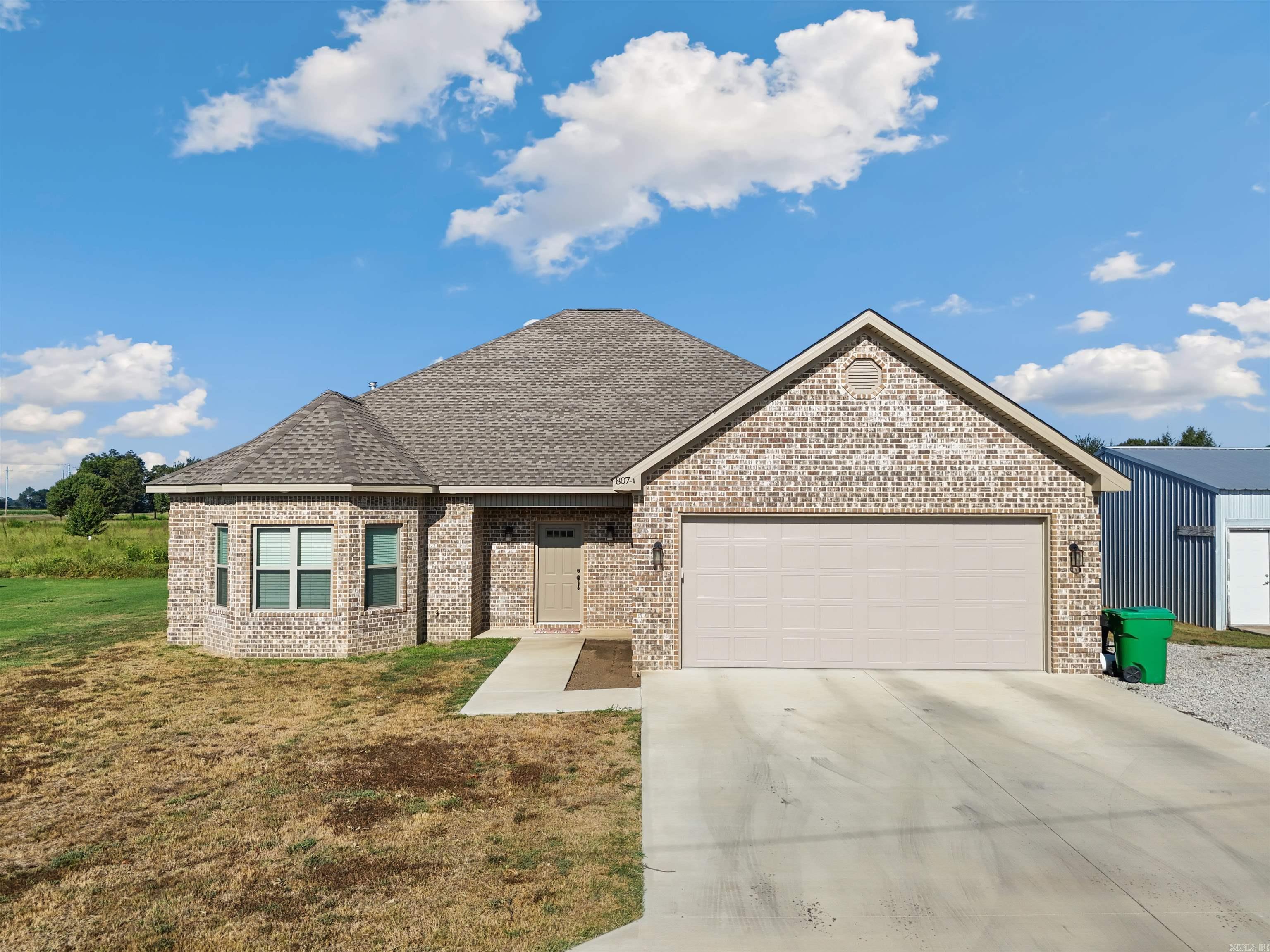 Newer custom-built home located in a quiet neighborhood just outside the city limits. Ready for new owners to enjoy the peace and relaxation of small-town living. located between Jonesboro and Blytheville offering a quiet commute to either town.