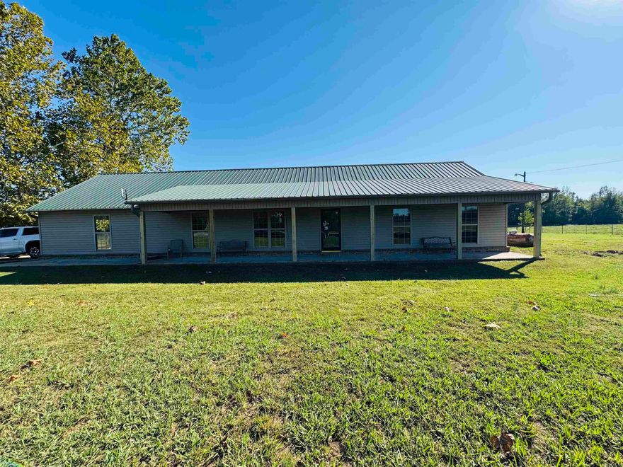 Beautiful Ranch style home sitting in the middle of open pastures now available! This 4 bedroom 2 bath offers a covered front porch that stretches across the entire house with recent updates including paint, deck, ceiling fans throughout as well as new LVP floors and tile just installed.  Nice open layout with big mud/laundry room and wide doors with no stairs for handicap accessible if needed. Has an oversized 2 car garage and detached storage room as well!