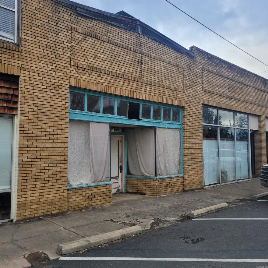 Own a Piece of History in Mount Ida! This iconic building was the original Sims Grocery Store, a landmark documented in Montgomery County historical books, the Mount Ida Museum, online records, and recognized by the Mount Ida Preservation Collective. It comes with the original deed, listing every owner since the lot was first recorded, making it a true piece of Mount Ida history. Additional historical records can be accessed through the historic Courthouse vault. The property features 15-foot ceilings in the storefront, original trim, and interior walls that are stable, preserving both charm and historical value. Operate a storefront, café, or retail space in front, with apartments or short/long-term rental suites in the back, or expand vertically by adding one or two stories. Original Sims Grocery Store national antique cash register included People in the community vividly remember purchasing hats and candy at the Sims Grocery store and the Mount Ida facebook community has a few personal stories and memories. Private off-street parking, and store front on-street parking Potential for commercial-residential.  Cash Only - As Is