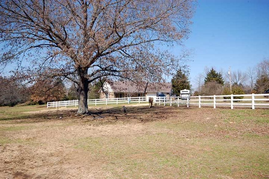 Bring your horses.  Beautiful 5 acres property located in Springhill.  Less than 10 min to I-40.  3 bed, 2 bath, large Kitchen/Dining combo.  Enclosed back porch with Hot Tub for relaxing evenings.  Wooster Schools.  Qualifies for 100% Rural Development Financing.