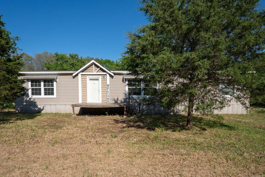 Welcome to your dream home! This stunning 3-bedroom, 2-bathroom manufactured home, built by Clayton in 2017, is nestled on generous acreage within the highly sought-after Cabot School District. Step inside to discover a Gourmet Farmhouse Kitchen, perfect for culinary enthusiasts, complete with elegant rock accents that beautifully enhance the Entertainment Center. The separate dining area offers an ideal space for family gatherings and special occasions. Retreat to the expansive Master Bedroom, featuring an exquisite adjoining Master Bath Suite that promises a spa-like experience. This property perfectly combines modern comfort with charming touches, making it the ideal place for you and your family. Don’t miss out on the opportunity to call this extraordinary home yours!