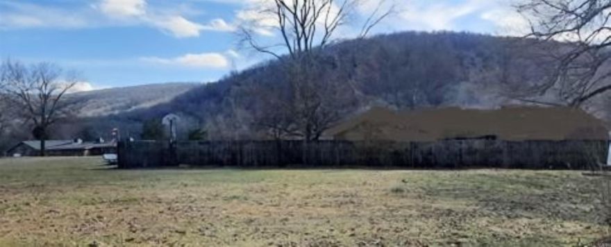 Very nice level lot in the city limits. Build your dream house here and look out over the mountains.