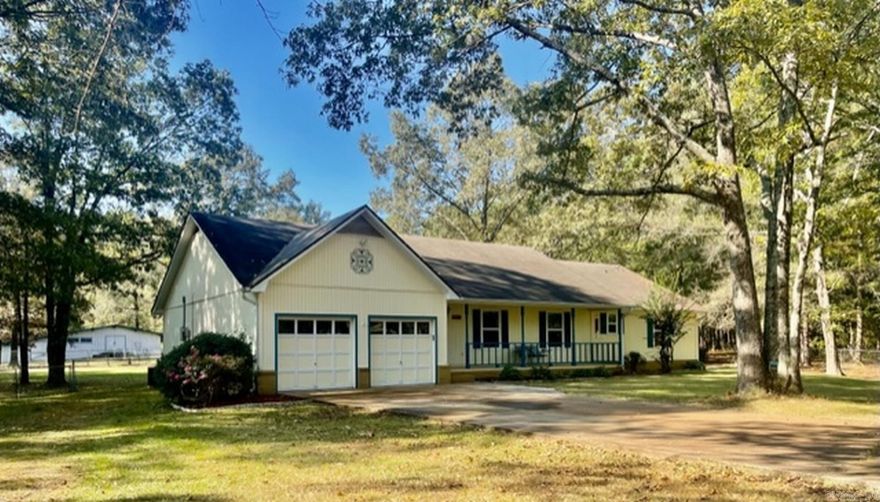 CHECK OUT THIS HORSE PROPERTY!! Welcome home to the country. This Saline County home has 4 bedrooms, 2 bathrooms, & sits on 6.06 beautiful fenced & cross fenced acres with a barn & a shop! The barn has electricity, 6 horse stalls, a tack room, & hay loft. The 24x24 shop has 220 electric service & an overhead door. The home has many updates including newer HVAC, windows, gutters, & Pergo flooring. The main living area is lined with windows & is open & shared by the kitchen, dining room, & great room. The kitchen has great cabinet & counter space, a pantry, & a new dishwasher & disposal. The great room has a wood burning fireplace with a brick hearth. The back door opens to a large patio to enjoy the tranquil backyard. The primary bedroom suite is approximately 800 sqft & has a sitting area & a walk-in closet that doubles as a large safe room. The laundry room also functions as a mud room with a separate entrance from the back of the property. Located in the East End Community of Saline County & in the Sheridan School District, one of the best in the state. Take a look at all the pictures...this country home will make you feel at home!! Only 15 minutes to DT Little Rock.