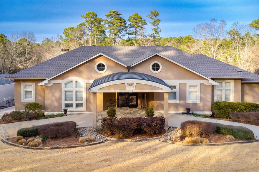 Located on the 7th fairway of Pleasant Valley Country Club, this golf course home offers four bedrooms (two up/two down), three full and two half baths, and exceptional indoor/outdoor living with 14" ceilings on main level. Main level with floor-to-ceiling windows in the great room with fireplace overlook the heated infinity pool with spa. Hearth room with fireplace open gourmet kitchen features a 6-burner gas cooktop, warming drawer, convection microwave, dishwasher, wine fridge, trash compactor, two pull-out pantries, and refrigerator. Built-in ice maker in laundry. Dedicated home office with balcony overlooking backyard. Primary suite includes heated bath floors and coffee station with fridge. Downstairs game/media room with wet bar, and abundant storage throughout. Three car garage with storage, circle drive with portico, full house generator, new roof (2023), gated security system for neighborhood. Resort style living in one of Little Rock’s most sought after golf communities. Come see! Showings start 3/16.