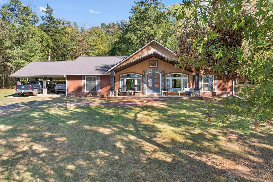 Open Airy Dream home on Hillside setting overlooking lush green valleys and close to River!! The finest in country living with this Walker built master craftsman home built in 2008. Offers 2160 heated and cooled space with front and back porches plus side attached carport. A massive great room area welcomes you with combo living, dining and chefs eat in kitchen with huge quartz island and quartz counter tops. Custom site built cabinets galore with brushed stainless appliances, double oven and cook top plus a wine cellar.  Split floor plan with main en suite and large bedrooms with walk in closets. Outside offers 34X34 foot shop building with lean to storage plus an RV shed. Located in the Ark/La/Tex and Oklahoma 4 states corner just 30 miles due N of Texarkana AR/TX. Surrounded by rivers, lakes and hunting areas. The located scenery and moderate climate just makes for a win/win.