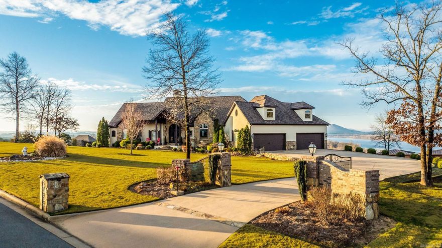 Luxury, Light & Unmatched Views on 1.51 Acres. Overlooking the Arkansas River & Pinnacle Mtn, this exceptional residence blends architectural beauty, modern comfort, and elevated outdoor living within a gated community. Enjoy a peaceful, tucked away setting, just minutes from Little Rock, N Little Rock, Maumelle, & Conway.  Soaring ceilings, curated finishes, & walls of glass frame breathtaking views while wide hallways, oversized doorways, and a private elevator provide seamless access throughout the home. A dramatic stone fireplace anchors the main living area, & the chef’s kitchen is thoughtfully designed for both effortless daily living & elevated entertaining. Outdoors, an expansive deck with a stone fireplace overlooks the resort-style pool, hot tub, & fully equipped outdoor kitchen—creating a refined, private retreat.  The lower level has kitchenette, guest suite, office/4th bedroom w/walk in-closet, wine cellar, & climate-controlled sunroom—ideal for multigenerational living or in-law suite. With three fireplaces, custom cabinetry, whole-home generator, 4+ car garage 800+ sq ft floored attic, this home delivers timeless luxury, elevated livability & endless possibilities