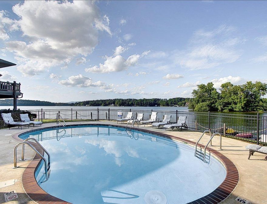 Lake Hamilton Lakefront Condo with Panoramic Views | Boat Slip Included | Nightly Rentals Allowed  Top-level end unit at Farr Shores offering 2 bedrooms and 2 full baths with expansive Lake Hamilton views. This lakefront condo features large picture windows and a private balcony overlooking the water, creating an inviting space for everyday living or relaxing getaways. Nightly rentals are permitted, making this property suitable for personal use, short-term rental, or full-time residence.  Interior highlights include a cozy fireplace, a primary suite with balcony access, in-unit laundry, and a covered patio ideal for outdoor dining or entertaining. The end-unit, upper-level location provides added privacy and natural light.  Farr Shores community amenities include a lakeside swimming pool, tennis courts, private boat ramp, boardwalk, boat trailer parking, and on-site caretaker. A boat slip and off-season boat storage are included.  Conveniently located near Oaklawn Racing & Casino, Bathhouse Row, Magic Springs, and Hot Springs National Park trails, this condo offers easy access to dining, entertainment, and outdoor recreation.